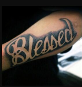 Grey Colored Blessed Tattoo Design on Forearm 