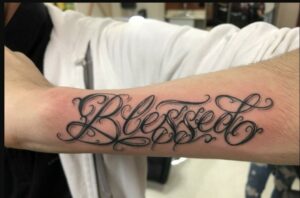 Blessed Tattoo on Upper Arm