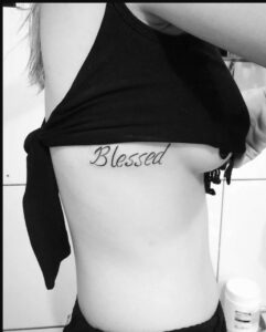 Blessed Tattoo with Gray and Black Floral Background 
