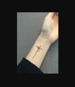Small Religious Hand Tattoo