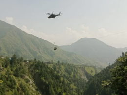 Four children were rescued from a stranded cable car in Pakistan as rescuers raced to save others.